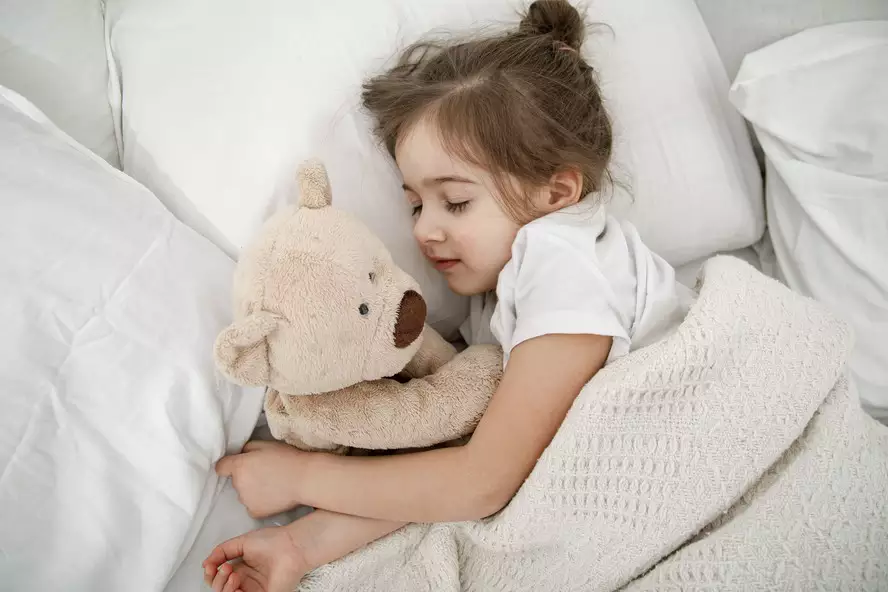 cute-little-girl-is-sleeping-bed-with-teddy-bear-toy-1-